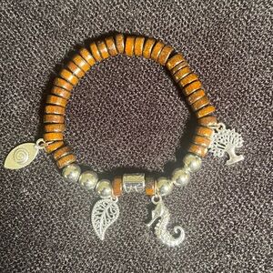 Wood beaded bracelet with silver charms
